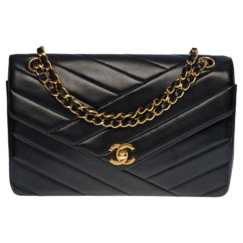 chanel herringbone quilted flap bag